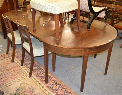 Lot 1324 - A George III mahogany dining table and six chairs