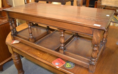 Lot 1340 - A reproduction oak rectangular coffee table with two nesting tables