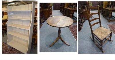 Lot 1342 - A 19th century rush seated rocking chair, a George III tripod table, and a painted pine...