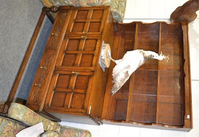 Lot 1355 - A mid 20th century oak sideboard with three cupboard doors, 134cm wide