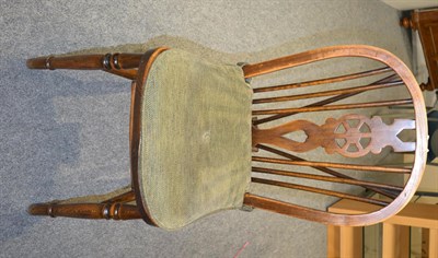 Lot 1357 - A set of six elm wheel-back Windsor chairs