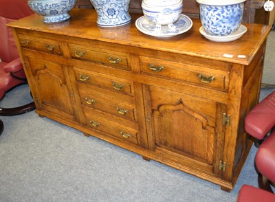 Lot 1359 - An oak Titchmarsh & Goodwin style dresser base, 169cm by 39cm by 83cm high