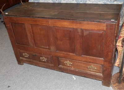 Lot 1367 - A joined oak chest with hinged lid