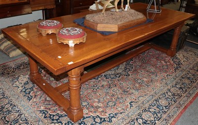 Lot 1380 - A reproduction oak plank top dining table on turned legs with block feet, 275cm by 114cm by...