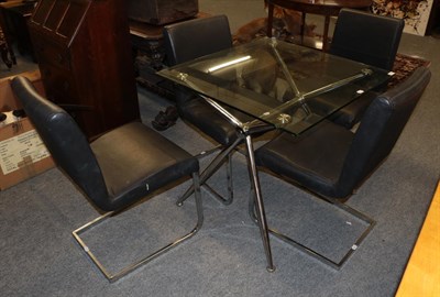 Lot 1389 - A glass top chromed metal table with four cantilever style chairs