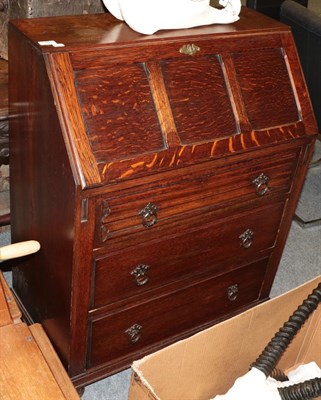 Lot 1391 - A 20th century oak bureau