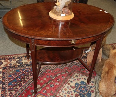 Lot 1392 - An Edwardian mahogany quarter veneered centre table, with bow fronted drawer, 107cm by 76cm by...