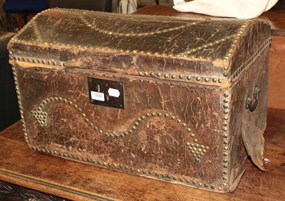 Lot 1394 - A Georgian pine domed-topped trunk in brass studded leather, and small Victorian metal bound trunk