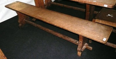 Lot 1680 - A Pair of Martin "Lizardman" Dutton Oak 6' Benches, each with shaped supports joined by a...