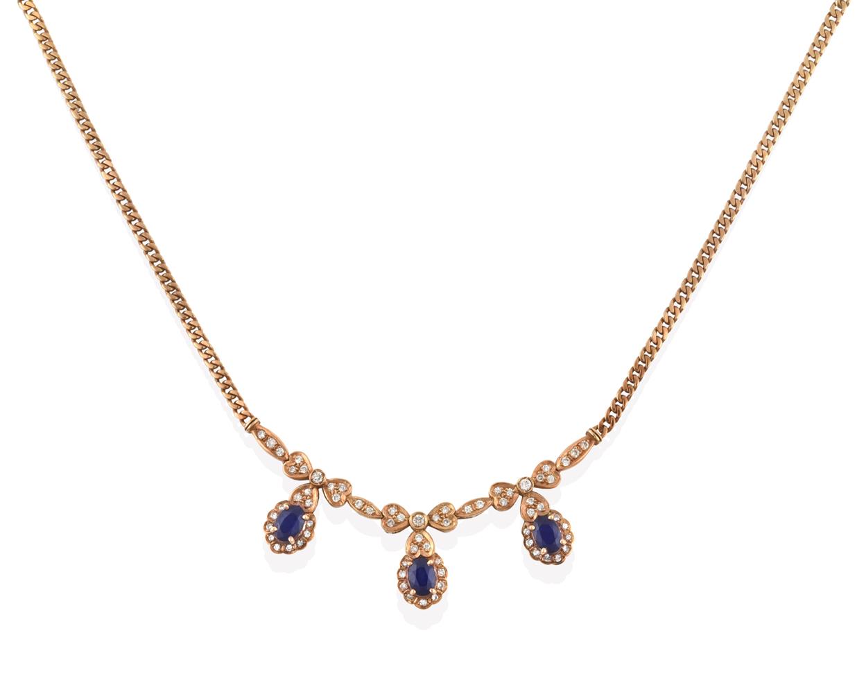 Lot 2002 - A Sapphire and Diamond Necklace, a central panel formed of three ribbon bow drops composed of...