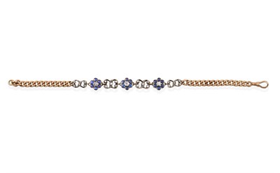 Lot 2005 - An Edwardian Sapphire and Diamond Bracelet, the central section formed of three daisy clusters...
