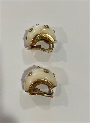Lot 2018 - A Pair of Shell Designed Earrings, each white stone decorated with yellow bead motifs, length...