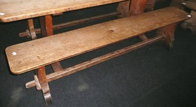 Lot 1693 - A Pair of Martin "Lizardman" Dutton Oak 6' Benches, each with shaped supports joined by a...