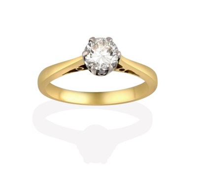 Lot 2028 - A Diamond Solitaire Ring, the round brilliant cut diamond in a white claw setting, to a tapered...