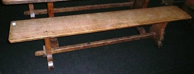 Lot 1694 - A Pair of Martin "Lizardman" Dutton Oak 6' Benches, each with shaped supports joined by a...