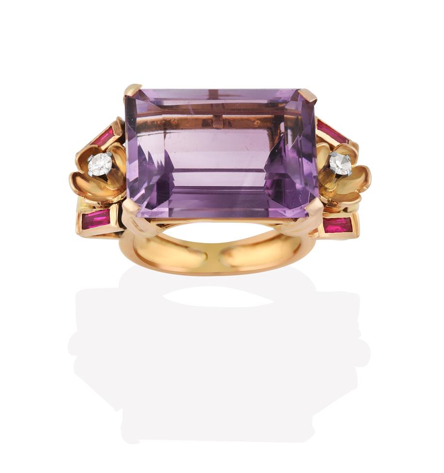 Lot 2031 - An Amethyst Ring, the emerald-cut amethyst in a yellow claw setting, flanked by foliate motifs with