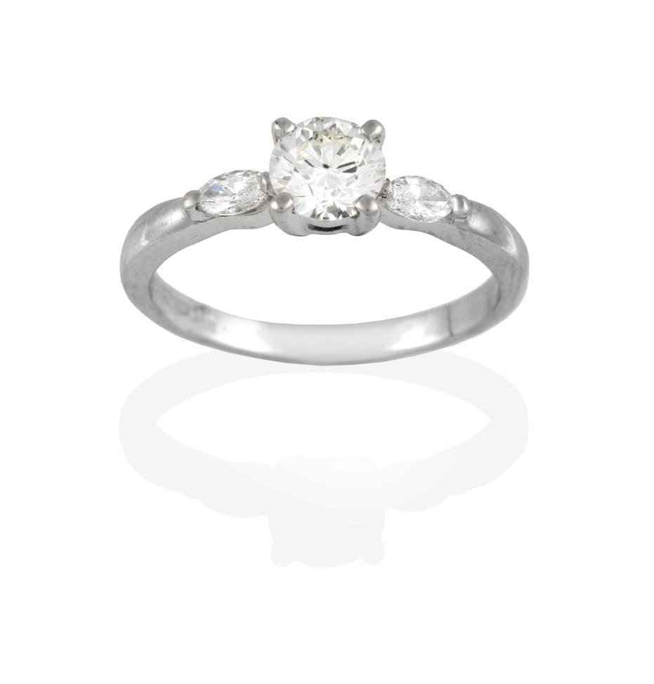Lot 2039 - A Platinum Diamond Solitaire Ring, the round brilliant cut diamond in a claw setting, to...
