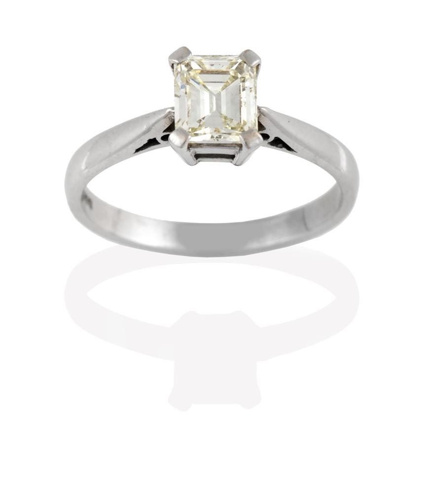 Lot 2041 - An 18 Carat White Gold Diamond Solitaire Ring, the emerald-cut diamond in a four claw setting, to a