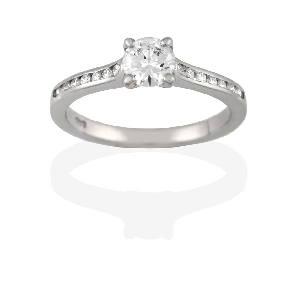 Lot 2042 - A Platinum Diamond Solitaire Ring, the round brilliant cut diamond in a claw setting, to a...