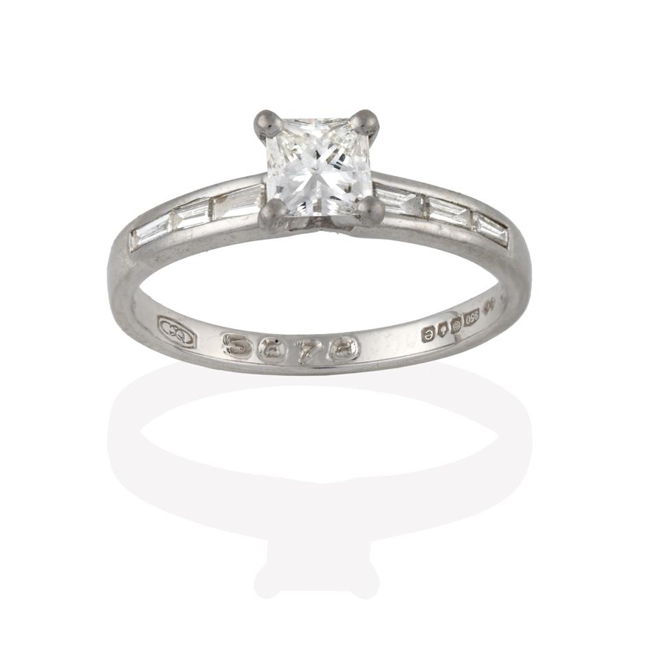 Lot 2044 - A Platinum Diamond Solitaire Ring, the princess cut diamond in a four claw setting, to baguette cut