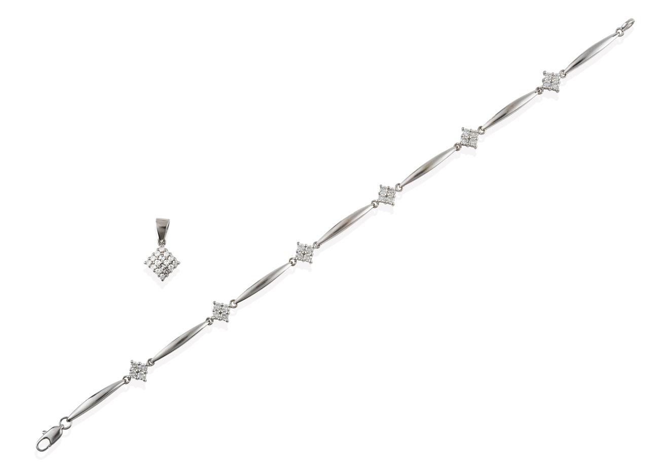 Lot 2053 - A Diamond Bracelet, formed of six round brilliant cut diamond clusters in white claw settings,...