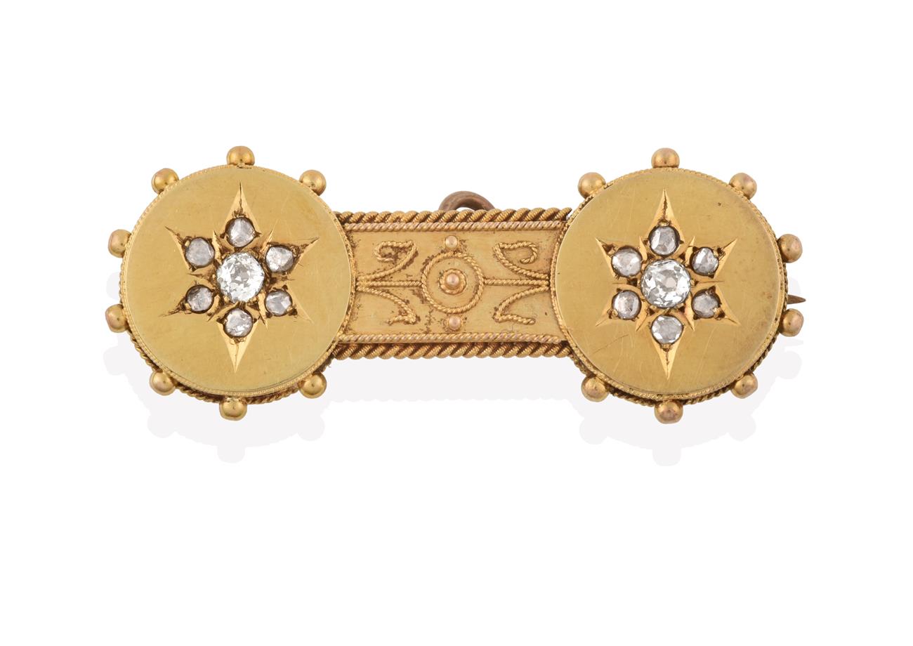Lot 2062 - A Victorian Diamond Bar Brooch, two yellow circular plaques each with a star motif set with old cut