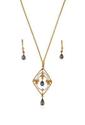 Lot 2065 - An Edwardian Sapphire and Seed Pearl Pendant on Chain, of openwork foliate lozenge design, with...
