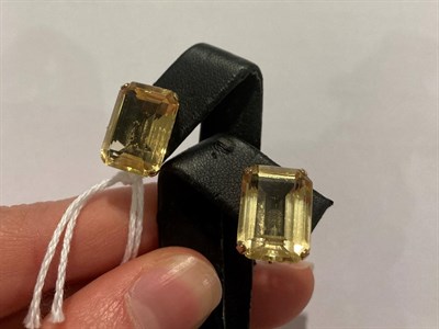 Lot 2069 - A 9 Carat Gold Citrine Ring, the emerald-cut citrine in a yellow four claw setting, to a...