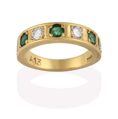 Lot 2079 - An Emerald and Diamond Half Hoop Ring, four round brilliant cut diamonds alternate with three round