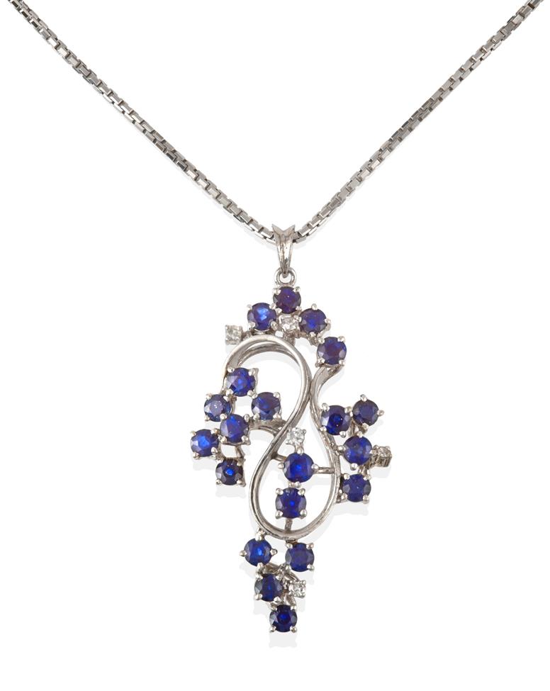 Lot 2085 - A Sapphire and Diamond Pendant on Chain, the abstract swirl motif pendant set throughout with...