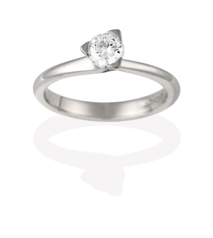 Lot 2090 - A Platinum Diamond Solitaire Ring, the round brilliant cut diamond in a claw setting, to...