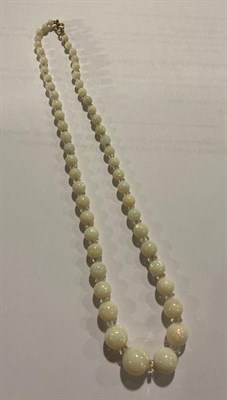 Lot 2097 - An Opal and Rock Crystal Necklace, fifty-four graduated opal beads spaced by faceted rock...