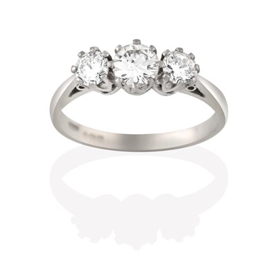 Lot 2102 - An 18 Carat White Gold Diamond Three Stone Ring, the graduated round brilliant cut diamonds, in...