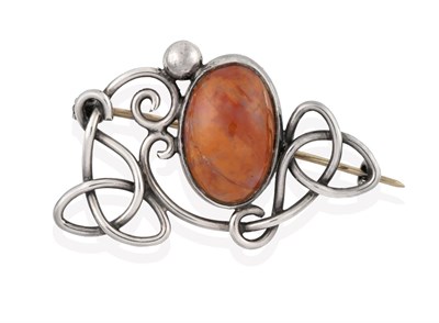 Lot 2109 - An Arts & Crafts Style Agate Brooch, an oval cabochon agate centrally in a white collet...