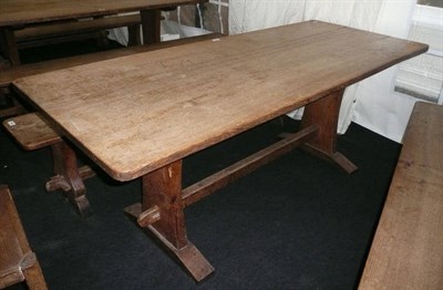 Lot 1702 - A Martin "Lizardman" Dutton Oak 6' Refectory Table, on two shaped end supports joined by a...