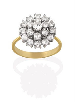 Lot 2112 - An 18 Carat Gold Diamond Cluster Ring, the round brilliant cut diamond within a double stepped...