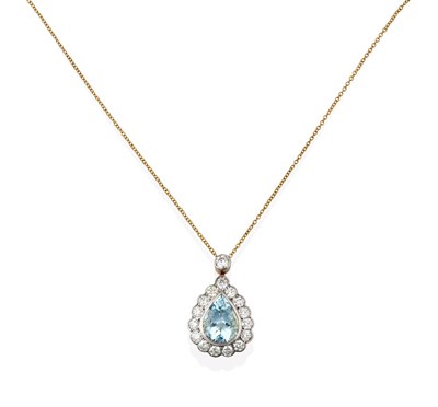 Lot 2122 - An Aquamarine and Diamond Cluster Pendant on Chain, the pear cut aquamarine within a border of...