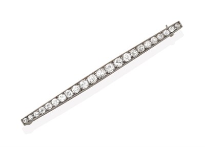 Lot 2128 - A Diamond Bar Brooch, the tapering bar set throughout with graduated old cut diamonds, in white...