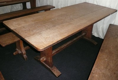 Lot 1704 - A Martin "Lizardman" Dutton Oak 6' Refectory Table, on two shaped end supports joined by a...