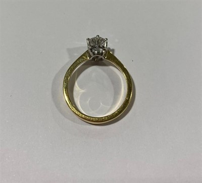 Lot 2144 - A Diamond Solitaire Ring, the oval cut diamond in a white claw setting, to a yellow tapered...