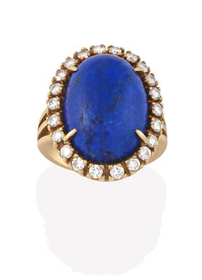 Lot 2145 - A Lapis Lazuli and Diamond Cluster Ring, the oval lapis lazuli cabochon within a border of...