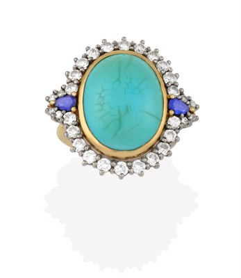 Lot 2148 - An 18 Carat Gold Turquoise, Sapphire and Diamond Cluster Ring, the oval turquoise cabochon in a...