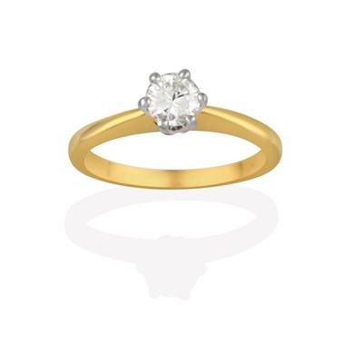 Lot 2159 - An 18 Carat Gold Diamond Solitaire Ring, the round brilliant cut diamond in a white claw...