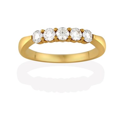 Lot 2161 - A Diamond Five Stone Ring, the round brilliant cut diamonds in yellow claw settings, to a plain...