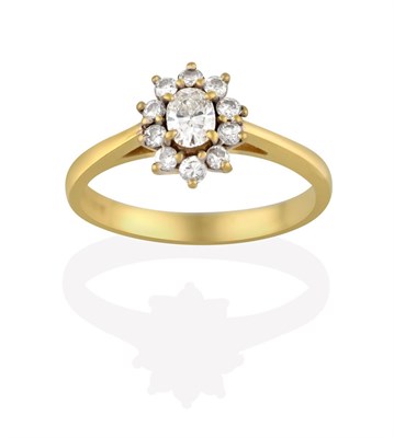 Lot 2165 - An 18 Carat Gold Diamond Cluster Ring, the central oval cut diamond within a border of round...