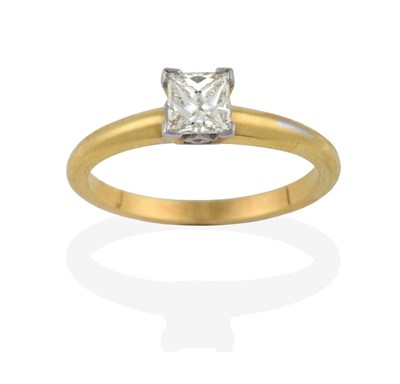 Lot 2167 - An 18 Carat Gold Diamond Solitaire Ring, the princess cut diamond in a white four claw setting,...