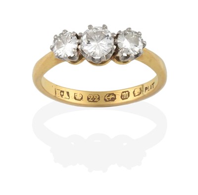 Lot 2169 - A 22 Carat Gold Diamond Three Stone Ring, the graduated round brilliant cut diamonds in white...