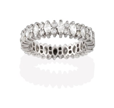 Lot 2177 - A Diamond Eternity Ring, the continuous band formed of marquise cut diamonds alternating with pairs