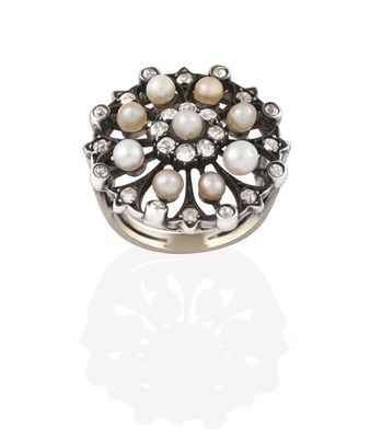 Lot 2178 - A Diamond and Seed Pearl Cluster Ring, the circular openwork plaque with a seed pearl centrally...