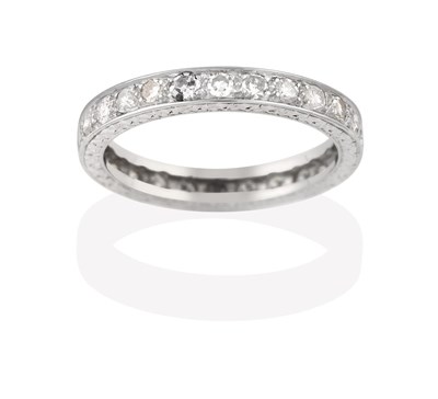 Lot 2179 - A Diamond Eternity Ring, the twenty-six round brilliant cut diamonds in white claw and channel...